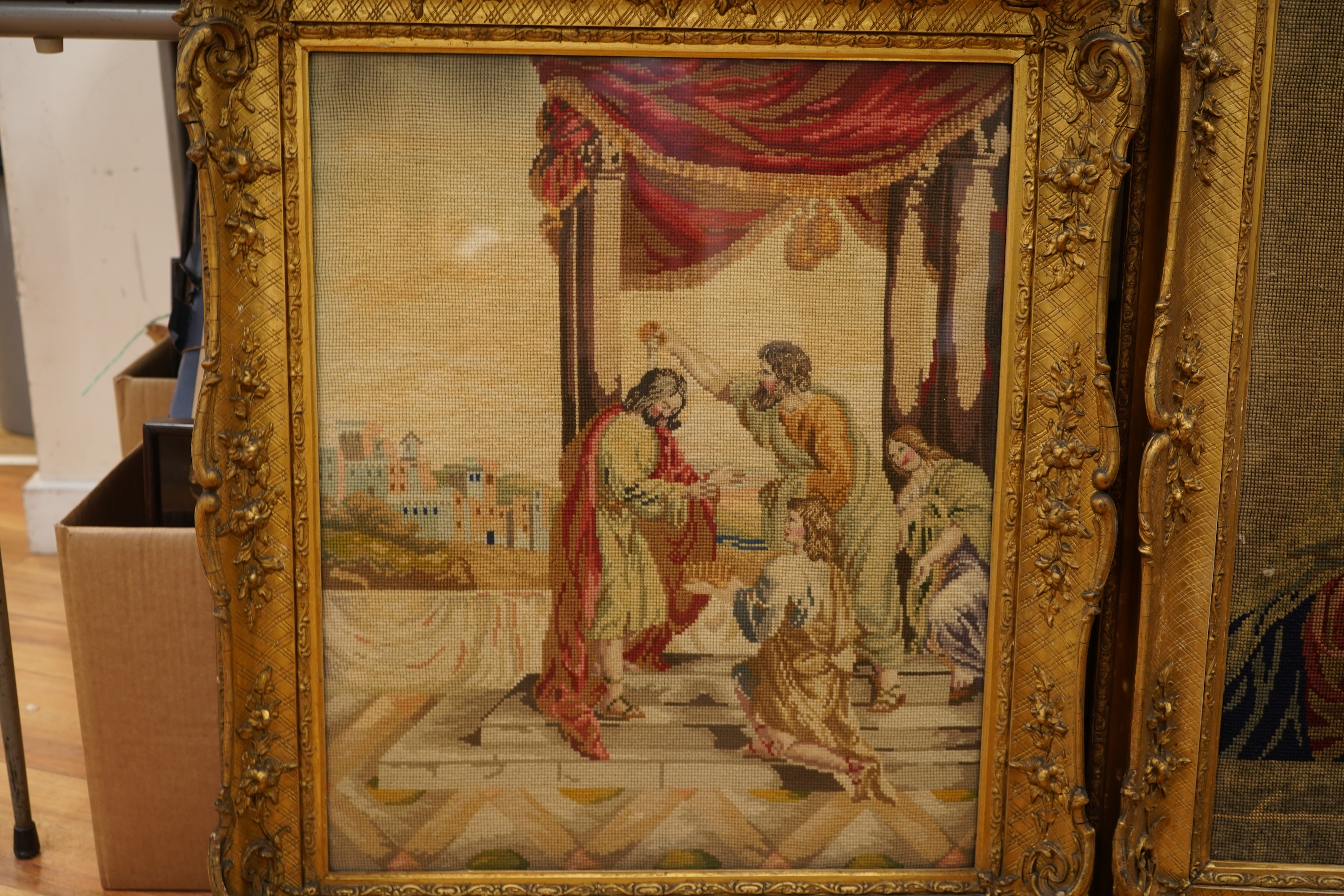 Two Victorian woolwork embroideries, one depicting Christ, the other John the Baptist both in carved gilt frames, largest 82cm high x 66cm wide
